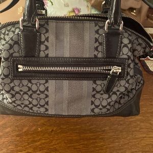 Gray and black coach signature satchel.
